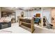 Cluttered basement featuring shelving, stored furniture, and a washing machine at 881 Rockbridge Sw Rd, Lilburn, GA 30047