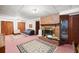 Finished basement featuring a brick fireplace and comfortable seating with a view of the backyard at 881 Rockbridge Sw Rd, Lilburn, GA 30047