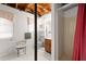 Basement bathroom with shower, vanity, and exposed pipes, featuring unfinished ceiling at 881 Rockbridge Sw Rd, Lilburn, GA 30047
