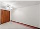A bedroom featuring a closet with louvred doors and neutral carpeting at 881 Rockbridge Sw Rd, Lilburn, GA 30047