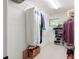 Spacious walk-in closet with adjustable wire shelving to neatly organize clothing and shoes at 881 Rockbridge Sw Rd, Lilburn, GA 30047