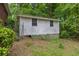 Exterior view of a backyard shed with two windows at 881 Rockbridge Sw Rd, Lilburn, GA 30047