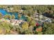 Aerial view of a lakeside house nestled among lush trees and waterfront properties at 10005 Lakeview Pkwy, Villa Rica, GA 30180