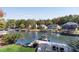 Lakefront property features lush landscaping, private dock, and serene water views at 10005 Lakeview Pkwy, Villa Rica, GA 30180