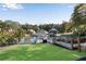 Beautiful backyard with a well-maintained lawn leading to a wooden deck and stunning lake views at 10005 Lakeview Pkwy, Villa Rica, GA 30180
