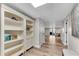 Finished basement boasts built-in bookshelves and modern flooring with views of the outdoor space at 10005 Lakeview Pkwy, Villa Rica, GA 30180