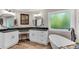 Beautiful bathroom with dual vanity and a luxurious soaking tub with decorative window at 10005 Lakeview Pkwy, Villa Rica, GA 30180