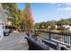 Enjoy lake views from the large wooden deck with outdoor seating, perfect for entertaining at 10005 Lakeview Pkwy, Villa Rica, GA 30180