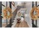 Inviting foyer with hardwood floors, elegant staircase, and stylish decor, creating a warm and welcoming entrance to the home at 10005 Lakeview Pkwy, Villa Rica, GA 30180