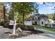 Charming home with a well-maintained yard, featuring a spacious driveway and lush landscaping, offering curb appeal at 10005 Lakeview Pkwy, Villa Rica, GA 30180