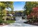 Attractive home with a sprawling driveway and a picturesque landscape, enhancing its welcoming and inviting presence at 10005 Lakeview Pkwy, Villa Rica, GA 30180