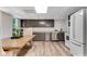 Basement kitchen area features stainless steel appliances, stylish cabinets, and an eat-in area at 10005 Lakeview Pkwy, Villa Rica, GA 30180