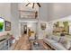 Open-concept living area showcasing vaulted ceilings and seamless flow into a well-designed kitchen at 10005 Lakeview Pkwy, Villa Rica, GA 30180