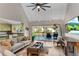 Welcoming living room features light wood floors, stylish furnishings, and deck access at 10005 Lakeview Pkwy, Villa Rica, GA 30180