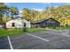 Exterior of recreation center with ample parking, manicured lawn and landscaping at 10005 Lakeview Pkwy, Villa Rica, GA 30180
