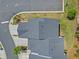 An aerial view of a home with a dark gray roof and well-maintained landscaping on a sunny day at 1385 Vayda Ct, Marietta, GA 30066
