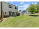 The backyard has a lush lawn with an enclosed patio, perfect for outdoor gatherings at 1385 Vayda Ct, Marietta, GA 30066