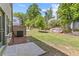 View of the backyard featuring a concrete patio and green grass at 1385 Vayda Ct, Marietta, GA 30066