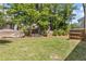 Spacious backyard featuring a well-kept lawn, mature trees, and a privacy fence at 1385 Vayda Ct, Marietta, GA 30066