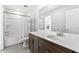 Bathroom with white countertop, dark cabinets, and bathtub with shower at 1385 Vayda Ct, Marietta, GA 30066