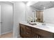 Bathroom featuring double sinks, sleek fixtures, and walk-in shower at 1385 Vayda Ct, Marietta, GA 30066