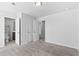 Spacious bedroom featuring neutral carpet, with an ensuite bathroom and double closets at 1385 Vayda Ct, Marietta, GA 30066