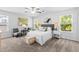 Bright bedroom featuring large windows, neutral walls, and a plush, padded stool at 1385 Vayda Ct, Marietta, GA 30066