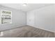 Carpeted bedroom showcasing natural light from a window and a double door closet at 1385 Vayda Ct, Marietta, GA 30066