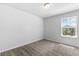 Empty bedroom with neutral carpet, white walls, and a window at 1385 Vayda Ct, Marietta, GA 30066