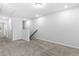 Empty bonus room with neutral carpet, white walls, and a view of the stairway at 1385 Vayda Ct, Marietta, GA 30066