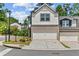 Charming townhome with a two-car garage, brick accents, and well-maintained landscaping at 1385 Vayda Ct, Marietta, GA 30066