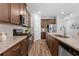 Modern kitchen with dark wood cabinets, stainless steel appliances, and granite countertops at 1385 Vayda Ct, Marietta, GA 30066