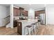 Modern kitchen featuring stainless steel appliances, a spacious island with seating, and ample cabinet space at 1385 Vayda Ct, Marietta, GA 30066