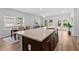 Open floorplan with dining table and kitchen island with granite countertops at 1385 Vayda Ct, Marietta, GA 30066