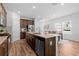 Stylish kitchen with stainless steel appliances, a spacious island, and an adjacent dining area at 1385 Vayda Ct, Marietta, GA 30066