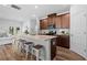 Stylish kitchen boasts stainless steel appliances, a large island with bar stools, and a view to the living area at 1385 Vayda Ct, Marietta, GA 30066