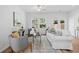 Bright living room with a ceiling fan, neutral furniture, and natural light at 1385 Vayda Ct, Marietta, GA 30066