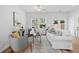 Bright living room featuring neutral decor, a ceiling fan, and natural light from windows at 1385 Vayda Ct, Marietta, GA 30066