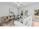 Bright living room featuring neutral decor and natural light from windows and glass door at 1385 Vayda Ct, Marietta, GA 30066