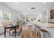 Bright living space featuring a dining area, kitchen island with seating, and natural light at 1385 Vayda Ct, Marietta, GA 30066