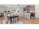 Open-concept living space with hardwood floors, a modern kitchen, dining area and a cozy living room at 1385 Vayda Ct, Marietta, GA 30066