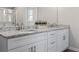 Elegant bathroom with double vanity, granite countertop, and a glass-enclosed shower at 2851 Fareed St, Douglasville, GA 30135