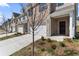 Street view of townhomes with attached garages and well-maintained landscaping at 2851 Fareed St, Douglasville, GA 30135
