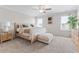 Relaxing main bedroom with neutral tones, carpet flooring, ceiling fan, and ample natural light at 2851 Fareed St, Douglasville, GA 30135