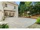 Exterior view of a home featuring a covered patio, basketball hoop and landscaped yard at 3290 Camellia Ln, Suwanee, GA 30024