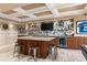 Entertainment bar area features a kitchen island, beverage cooler, tile backsplash, recessed lighting, and decor at 3290 Camellia Ln, Suwanee, GA 30024