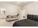 Spacious bedroom with a sitting area, dresser, and multiple doorways creating an open feel at 3290 Camellia Ln, Suwanee, GA 30024