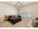 Neutral bedroom with a modern bed, sitting area, and plenty of natural light from shuttered windows at 3290 Camellia Ln, Suwanee, GA 30024