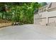 View of garage and the basketball hoop in the driveway with landscaping at 3290 Camellia Ln, Suwanee, GA 30024