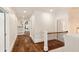 Beautiful hallway features hardwood flooring, white trim, and abundant natural light at 3290 Camellia Ln, Suwanee, GA 30024